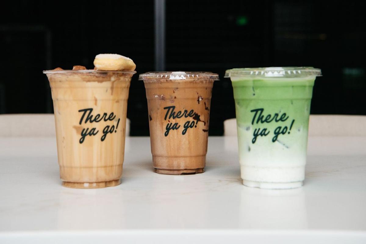 Three iced drinks in There ya go! cups