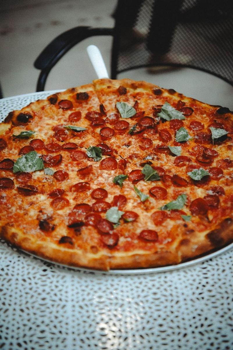 Smokestack pie with cupped pepperoni and basil