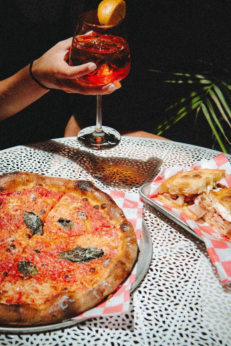 Spritz, pizza and a sandwich on the patio